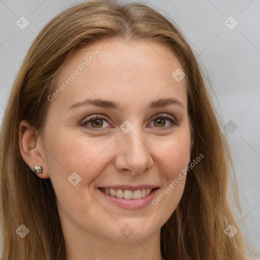 Joyful white adult female with long  brown hair and grey eyes