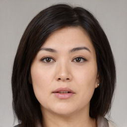 Neutral asian young-adult female with medium  brown hair and brown eyes