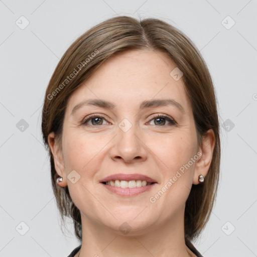 Joyful white young-adult female with medium  brown hair and grey eyes