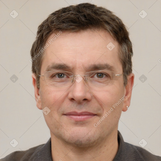 Joyful white adult male with short  brown hair and grey eyes