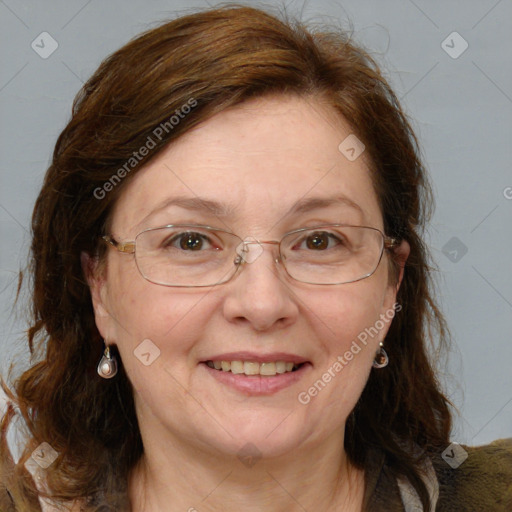 Joyful white adult female with medium  brown hair and blue eyes