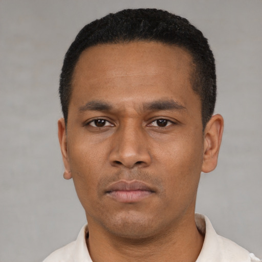 Neutral latino young-adult male with short  black hair and brown eyes