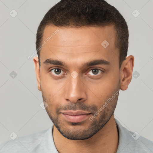 Neutral white young-adult male with short  brown hair and brown eyes