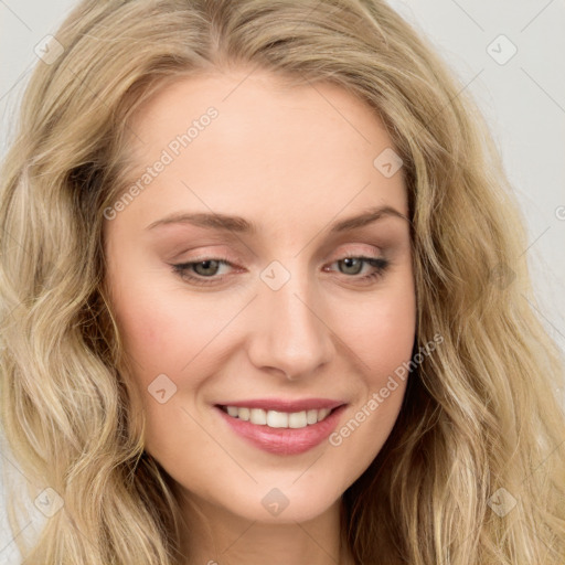 Joyful white young-adult female with long  brown hair and blue eyes