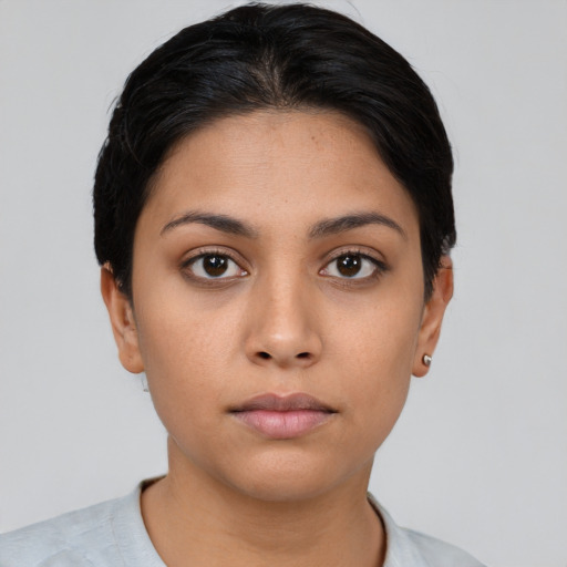 Neutral latino young-adult female with short  black hair and brown eyes