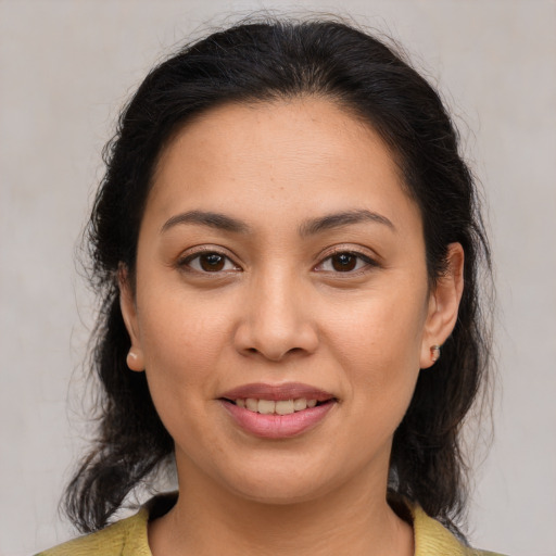 Joyful white young-adult female with medium  brown hair and brown eyes