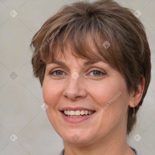 Joyful white adult female with medium  brown hair and blue eyes