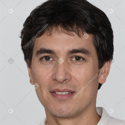 Joyful white adult male with short  brown hair and brown eyes