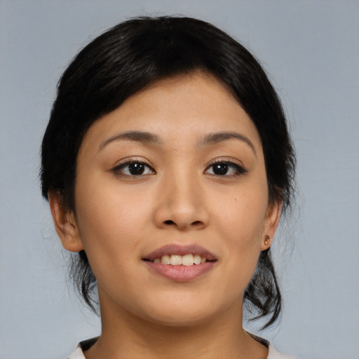 Joyful asian young-adult female with medium  brown hair and brown eyes