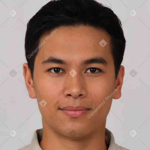 Joyful asian young-adult male with short  black hair and brown eyes