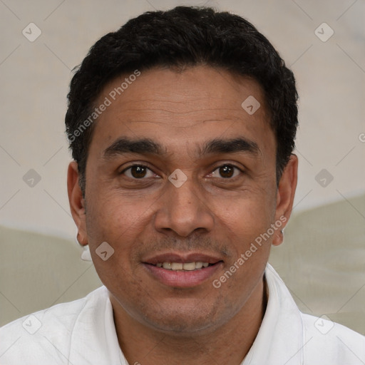 Joyful white adult male with short  black hair and brown eyes