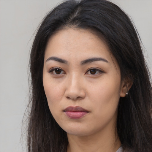 Neutral asian young-adult female with long  brown hair and brown eyes