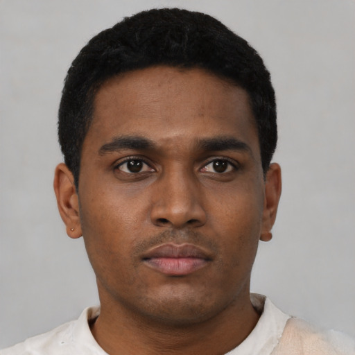 Neutral black young-adult male with short  black hair and brown eyes