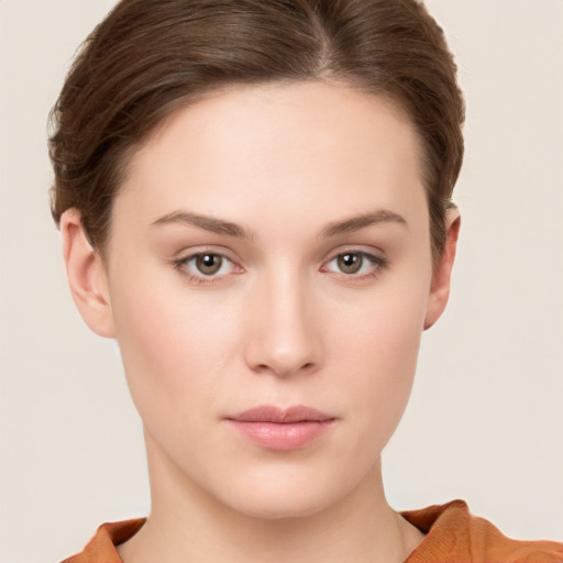 Neutral white young-adult female with short  brown hair and brown eyes