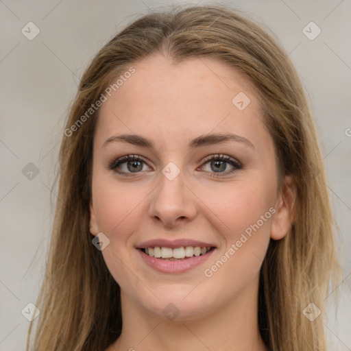 Joyful white young-adult female with long  brown hair and green eyes