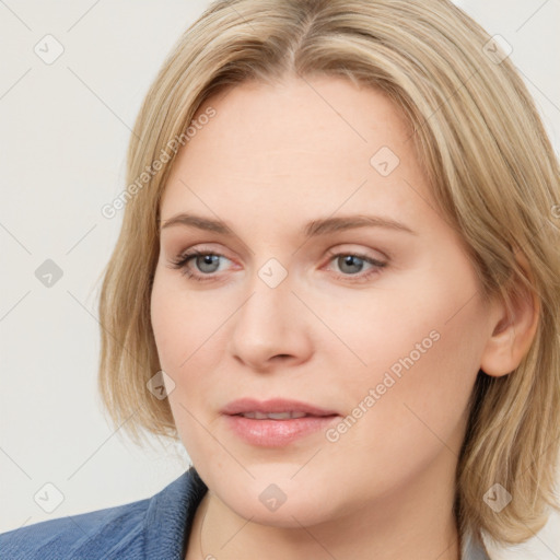 Joyful white young-adult female with medium  brown hair and blue eyes