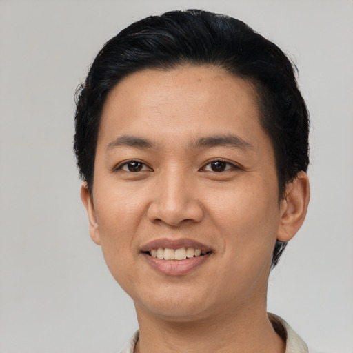 Joyful asian young-adult female with short  black hair and brown eyes