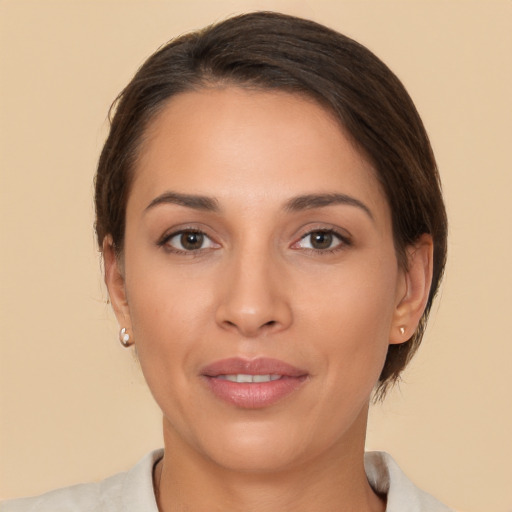 Joyful white young-adult female with medium  brown hair and brown eyes