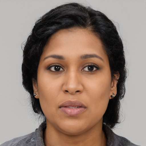 Neutral latino young-adult female with medium  black hair and brown eyes
