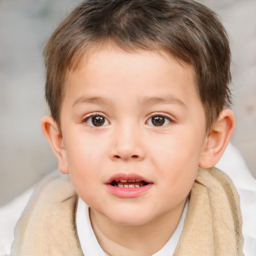 Joyful white child male with short  brown hair and brown eyes