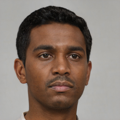 Neutral black young-adult male with short  black hair and brown eyes