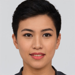 Joyful asian young-adult female with short  black hair and brown eyes