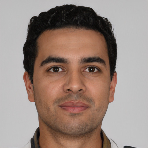 Neutral latino young-adult male with short  brown hair and brown eyes