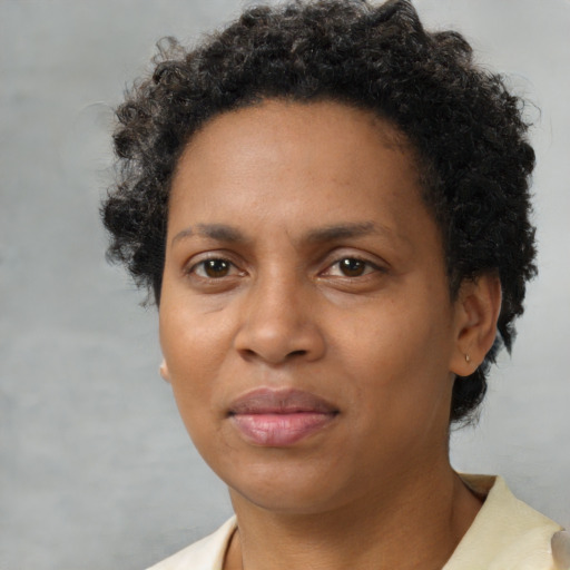Neutral black adult female with short  brown hair and brown eyes