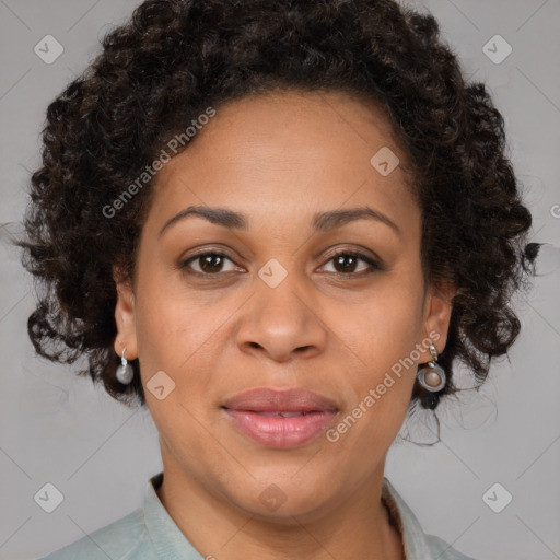 Joyful black adult female with short  brown hair and brown eyes