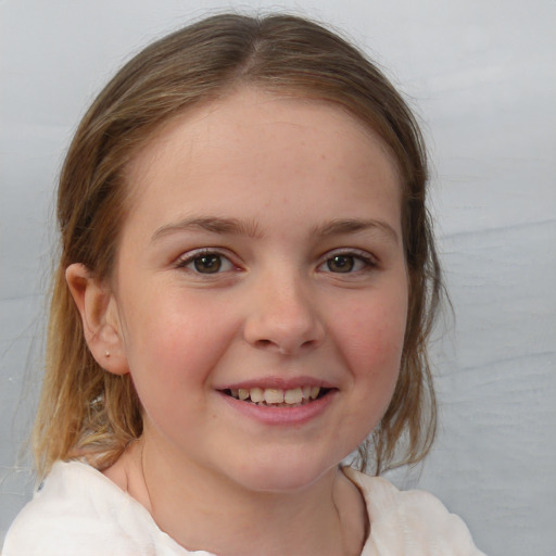 Joyful white child female with medium  brown hair and brown eyes