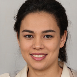 Joyful latino young-adult female with medium  brown hair and brown eyes