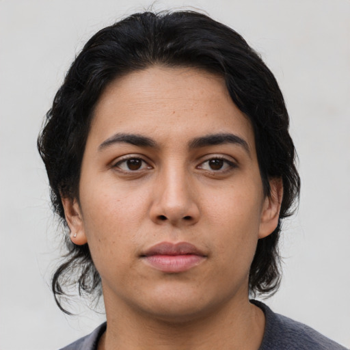 Neutral latino young-adult female with medium  black hair and brown eyes