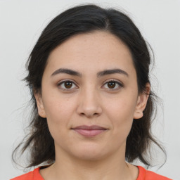 Joyful white young-adult female with medium  brown hair and brown eyes