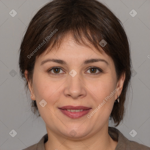 Joyful white adult female with medium  brown hair and brown eyes