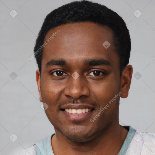 Joyful black young-adult male with short  black hair and brown eyes