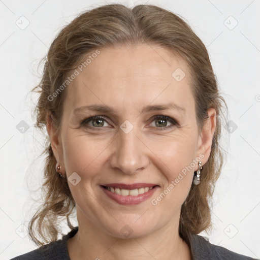 Joyful white adult female with medium  brown hair and grey eyes
