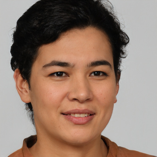 Joyful latino young-adult female with short  brown hair and brown eyes