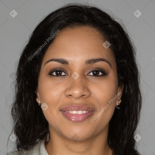 Joyful black young-adult female with long  brown hair and brown eyes