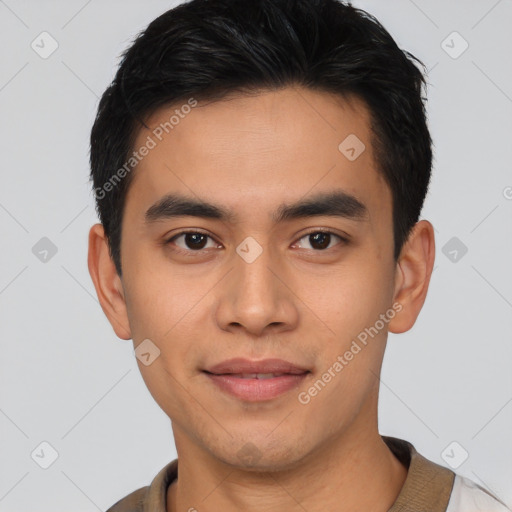 Joyful asian young-adult male with short  brown hair and brown eyes