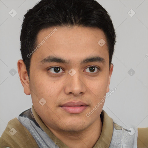 Joyful latino young-adult male with short  brown hair and brown eyes