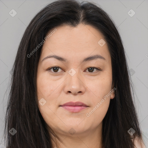 Joyful asian young-adult female with long  brown hair and brown eyes