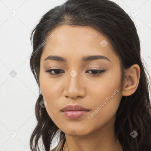 Joyful asian young-adult female with long  brown hair and brown eyes