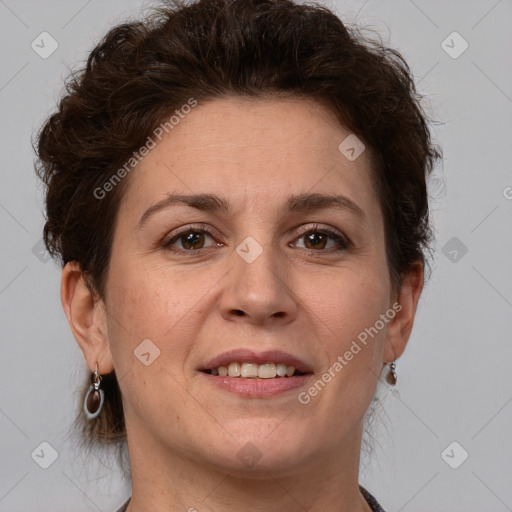 Joyful white adult female with short  brown hair and brown eyes