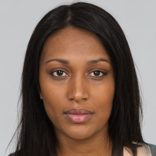 Neutral black young-adult female with long  brown hair and brown eyes