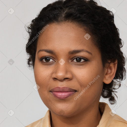 Joyful black young-adult female with long  brown hair and brown eyes