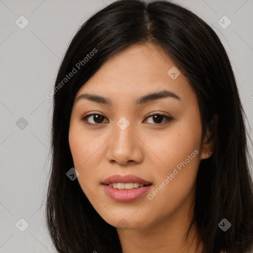 Joyful asian young-adult female with long  brown hair and brown eyes