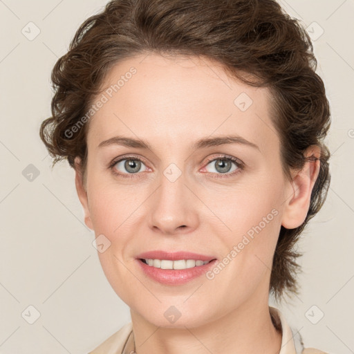 Joyful white young-adult female with medium  brown hair and green eyes