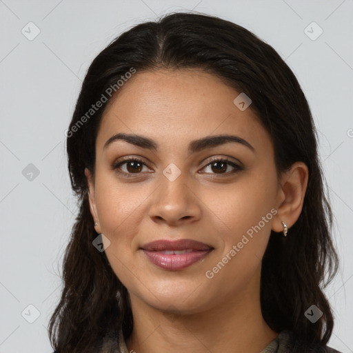 Joyful latino young-adult female with long  brown hair and brown eyes