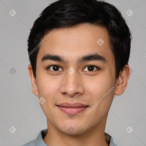 Joyful asian young-adult male with short  brown hair and brown eyes