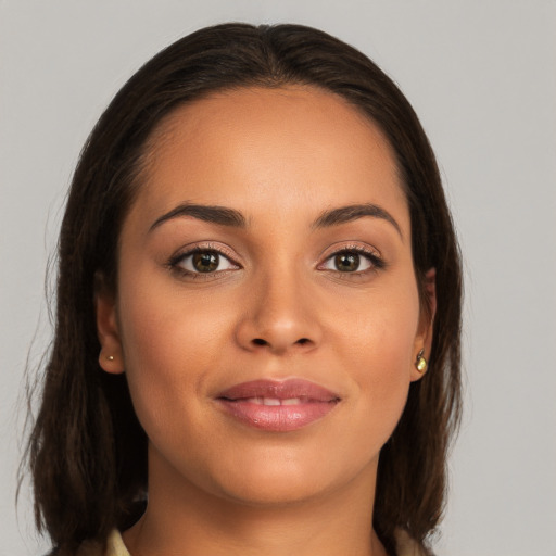 Joyful white young-adult female with long  brown hair and brown eyes